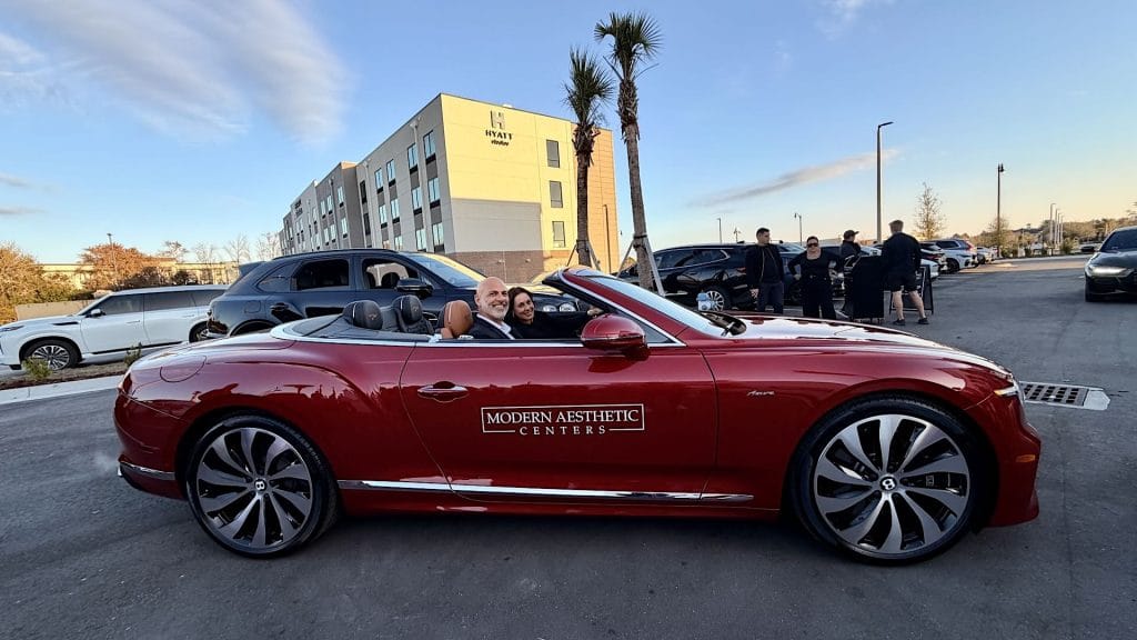 paul hassan in bentley car at modern aesthetic centers grand opening in village crossing center jacksonville fl